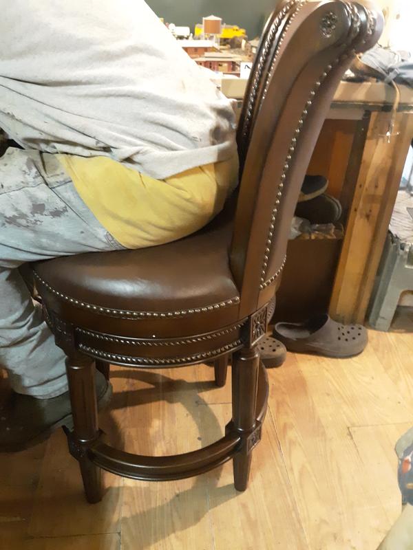 Here is my husband sitting on the maven Lane Pullman counter stool enjoying it