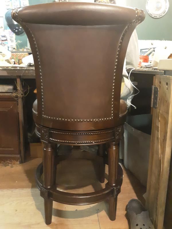 Here is the maven Lane Pullman counter stool  carved out with fleur De Lis flower, nailhead trim, and Braid like engraved into wood.