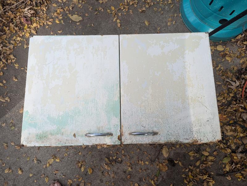 Cabinet the power washer stripped old paint from.