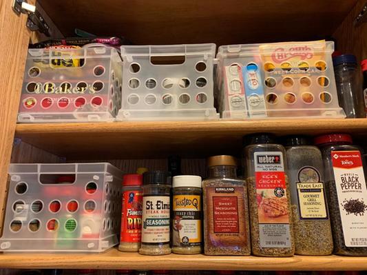 Mini Crates on our top 2 shelves in the kitchen cabinet.