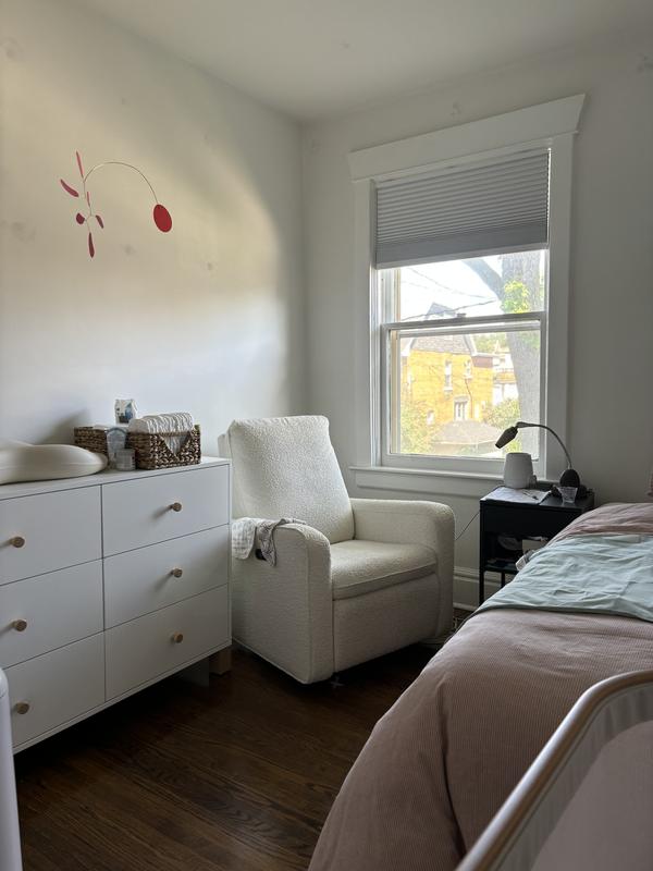 My favourite place in the house, sitting in my cozy bouclé chair with my baby looking out the window