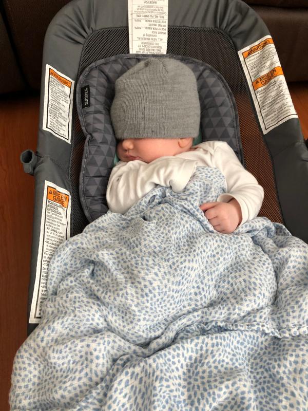 infant sleeping in bouncer