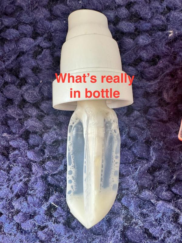 This is the actual pouch of product that is concealed tightly inside the deceptively large looking bottle.