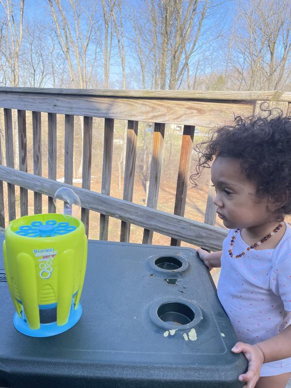 Baby girl enjoying bubbles