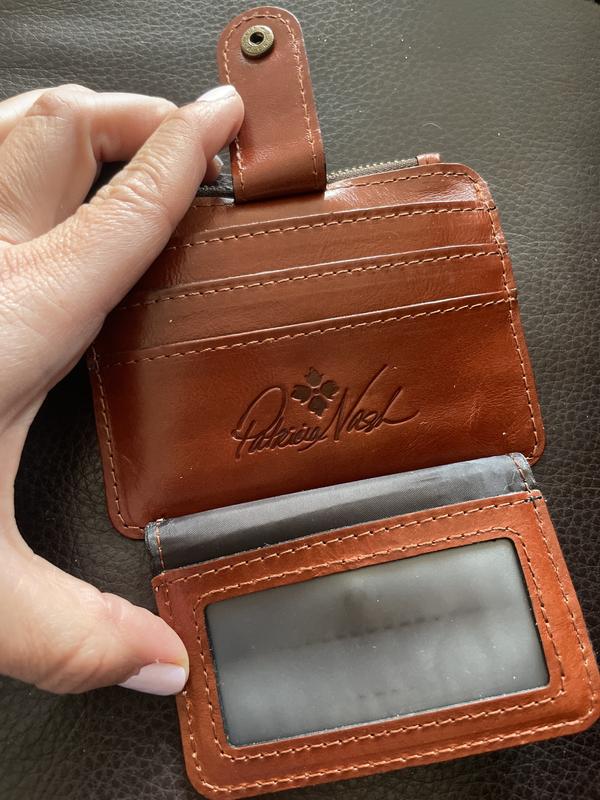 Flap opens and has a perfect place for ID and important cards. The wallet still closes up thin.
