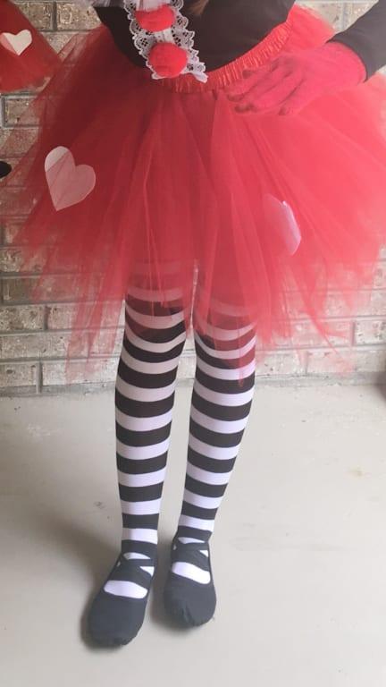 Striped Tattered Neon Tights For Children as a costume accessory