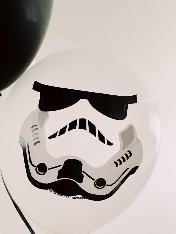 Storm trooper with sticker. Logo sticks out if you're not paying attention.