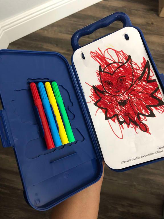 Hooks to keep pages in place and a spot to snap in the markers