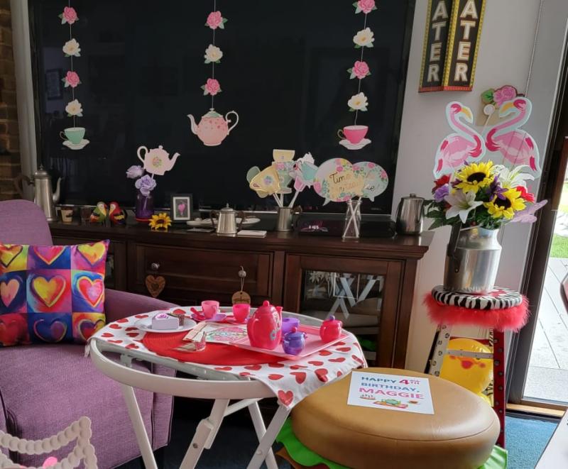 String decorations hanging on our big TV screen