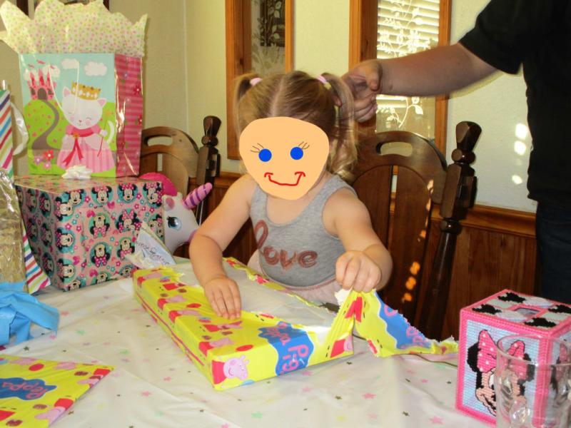 wrapped in the designed part of the plastic tablecloth