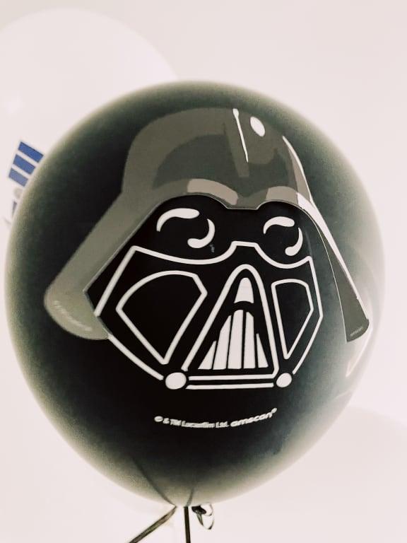 Darth vader with sticker. Ends stick out of sticker.