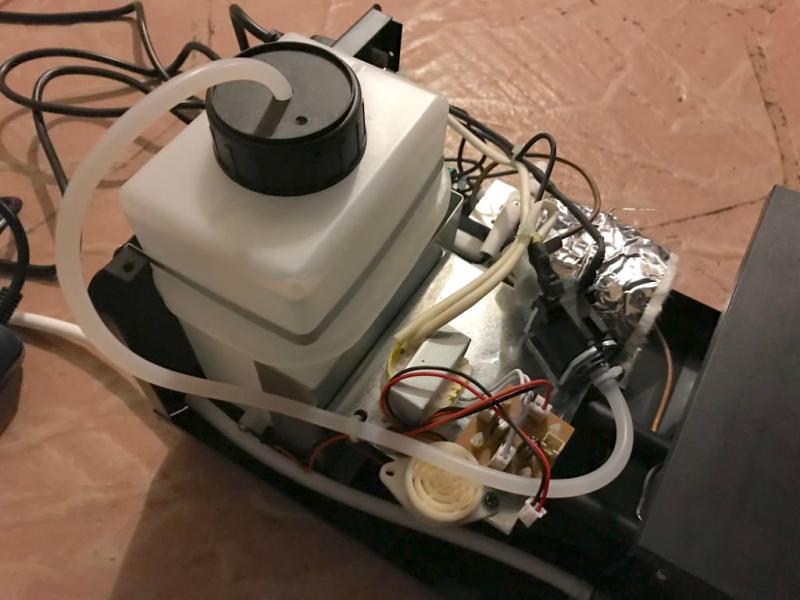 Speaker is white circle, just follow cable and unplug