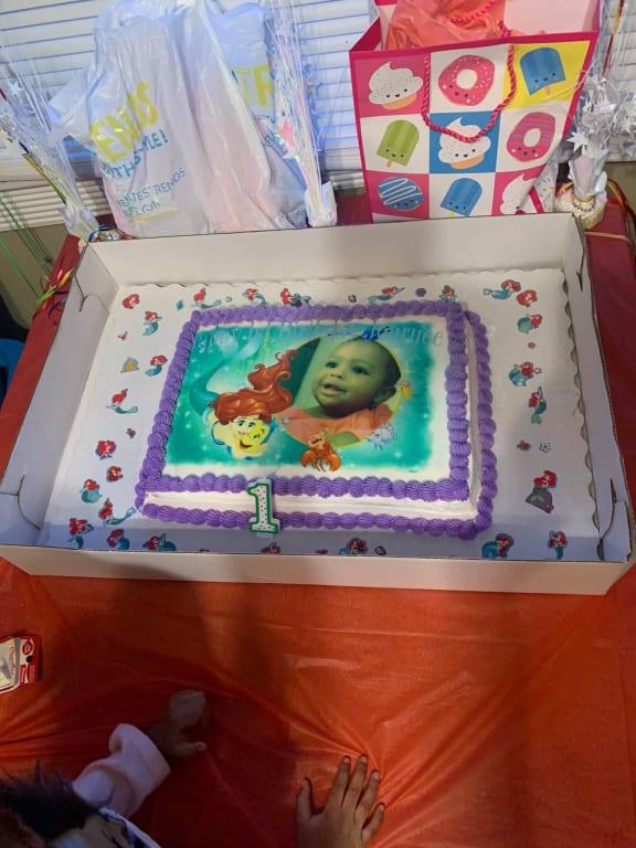 I put the sticker around her cake