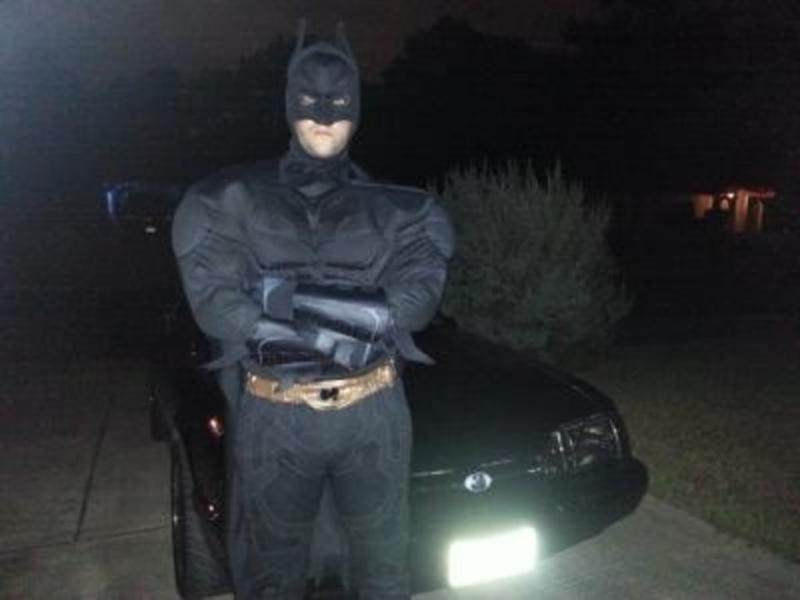 My Batman look in front of my Batmobile(A 93 black on black Ford Mustang Fox body)