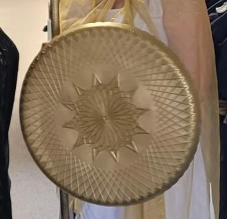 Spray-painted it to make a gold shield for Athena costume.