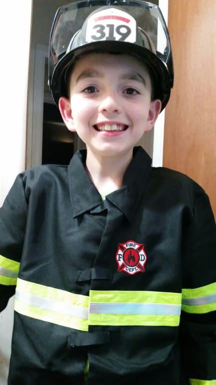He Loves his Fireman Outfit!! :)