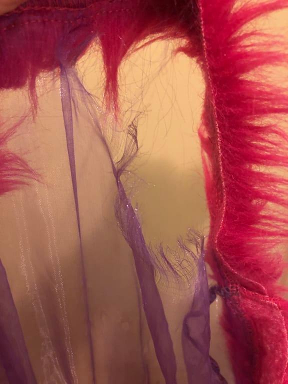 Bottom of the dress frayed away as well