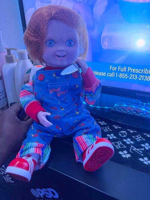 Child s Play Chucky Animated Light Up Horror Character Multi Coloured 12 in Sound Light Activated Indoor Outdoor Decoration for Halloween Party City