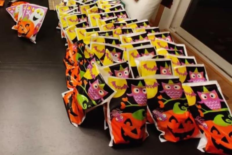 Bags lined up after being filled with candy