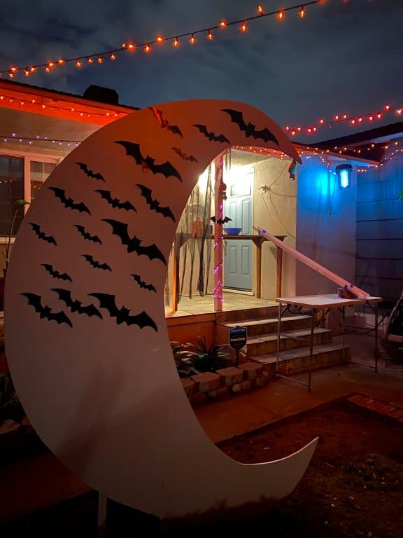 Bats flying over the moon on Halloween