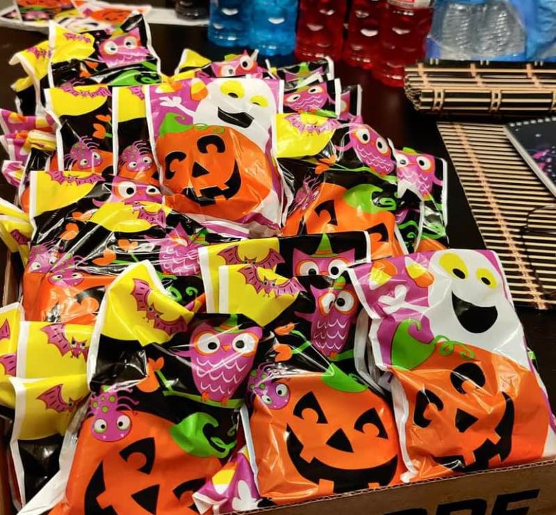 Treat bags filled with candy and ready for Halloween