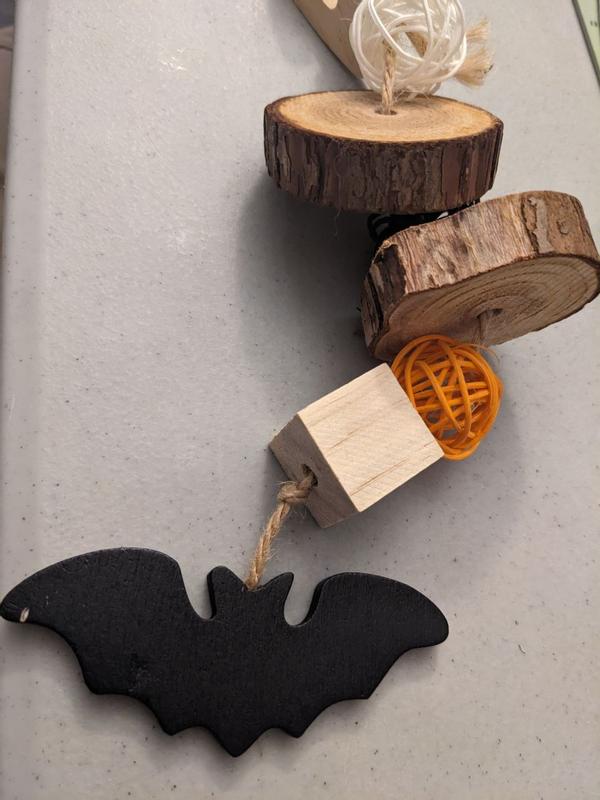 Small knot for cube to slip over + the defect in the paint on the bat.