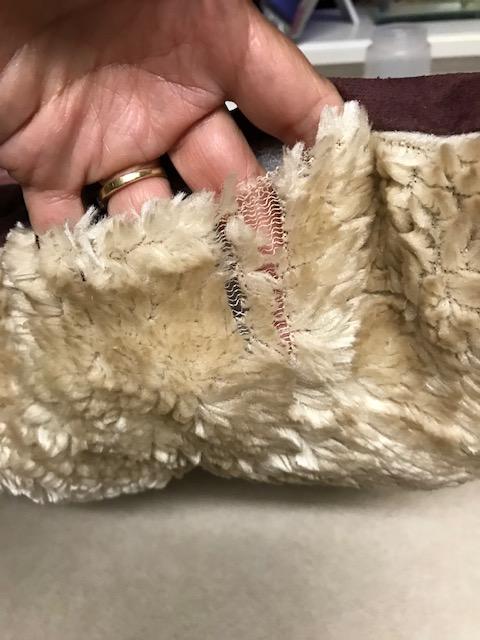 Not sure what this material is, but it's unfortunate that it's on the pillow.