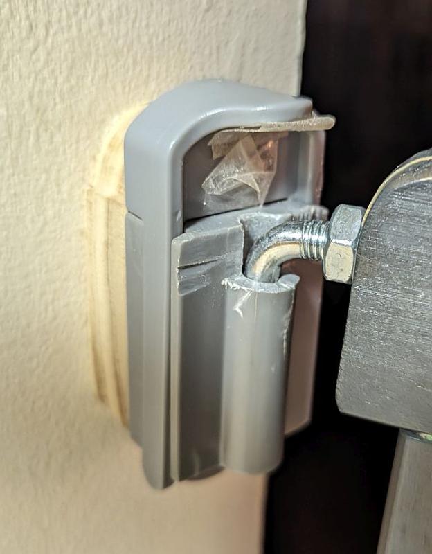 Cracked hinge piece.