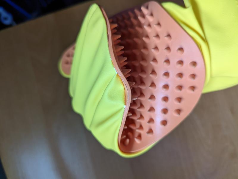 The glove is peeling away from the silicone when you bend your hand.