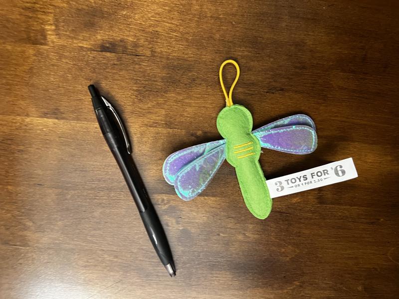 Size reference. Placed toy next to a average sized pen to show the size of the toy in comparison to the pen.