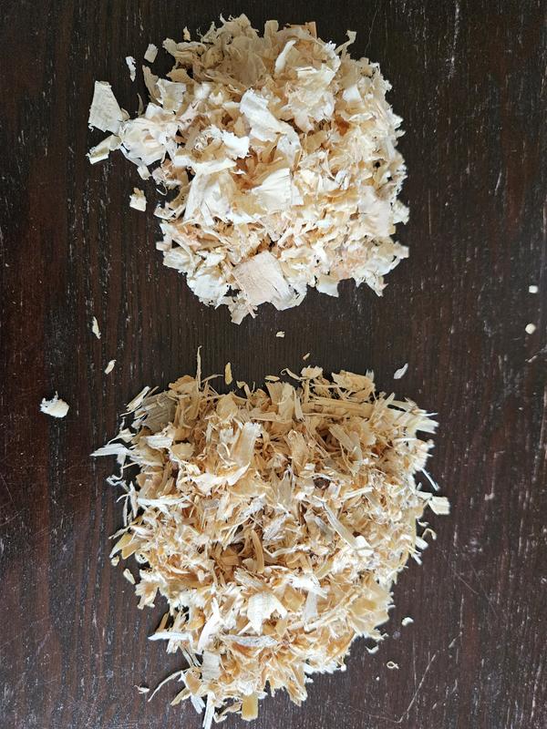 The newer shavings are the darker, shredded looking wood and the older is the fluffy, soft looking pile.