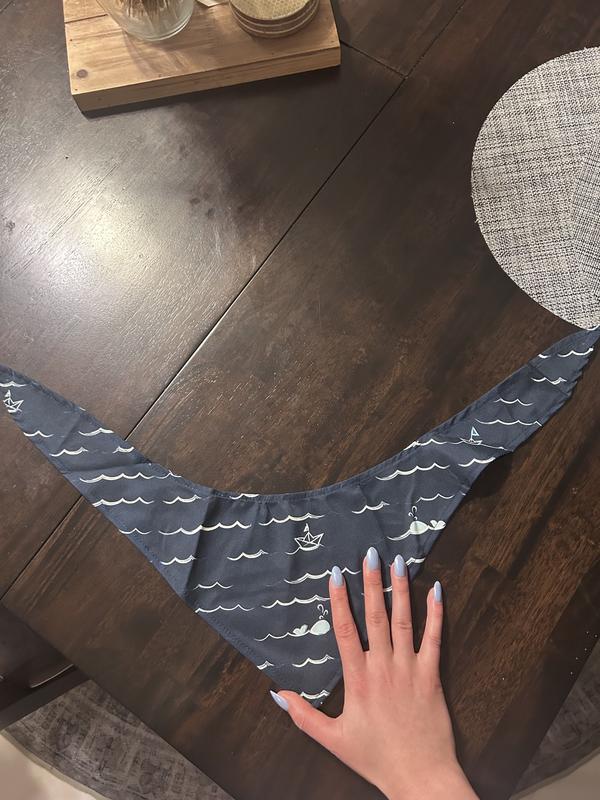 Adult hand for size reference. Material is soft and silky in a way.