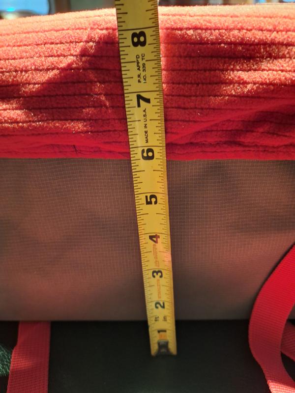 Approximately 8" high, the size works well and he can see out the window without a problem.