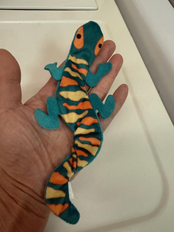 Toy is about 8" long, and basically flat