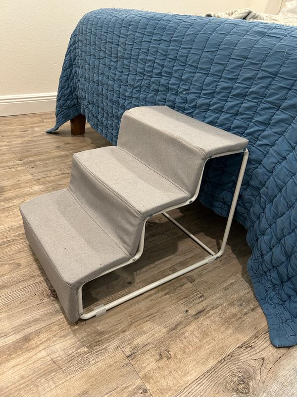 Stairs next to bed for scale