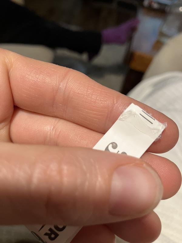 Cheaply glued in tag.