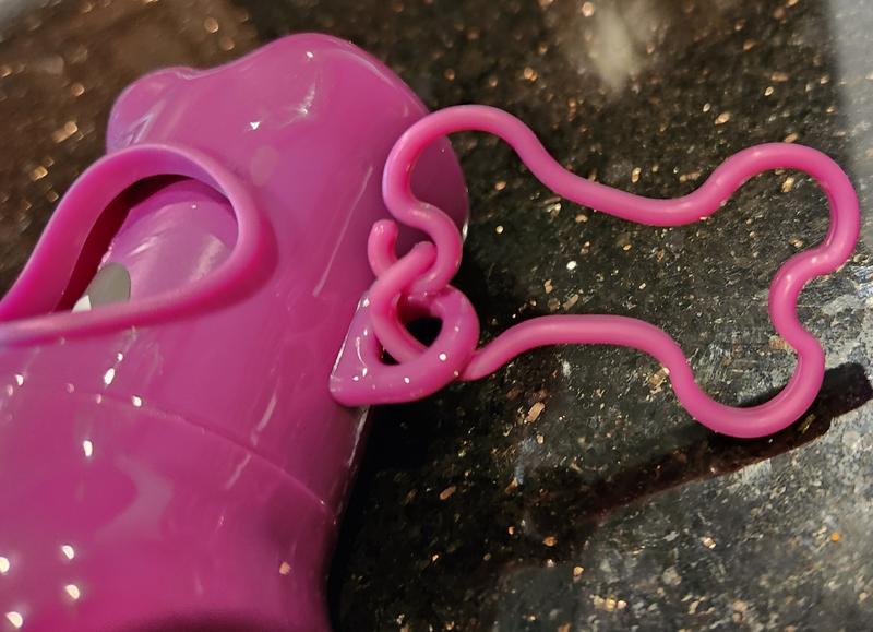This is a close-up of the included plastic clip, which should fit most leashes