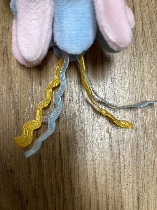 The blue ribbon on the left is already showing wear after a few days.