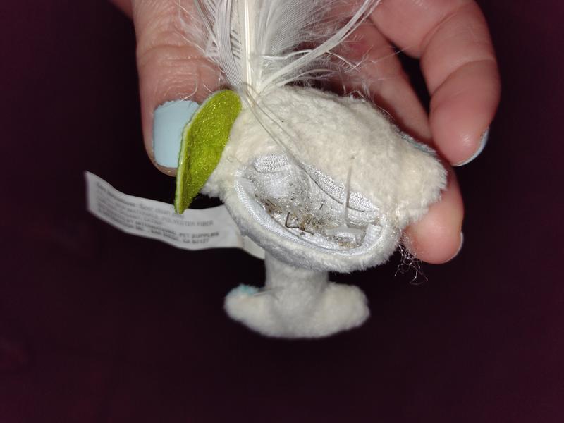 Cat nip stuck in Velcro and won't close plus it's too small an opening to fill. This is a closed as I can get it. One attempt to fill it and it's like this.
