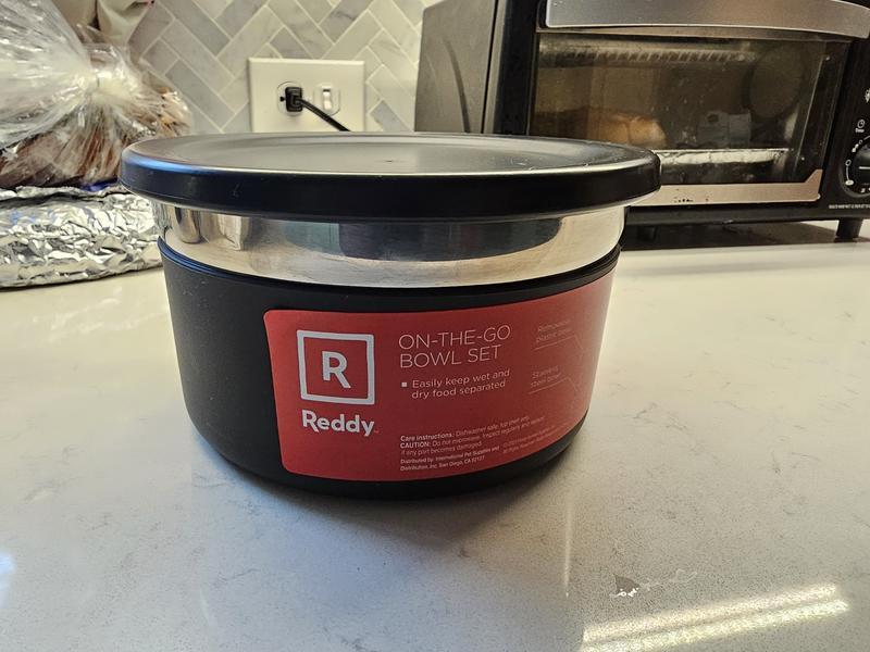 Self contained dog bowl set with lid placed.