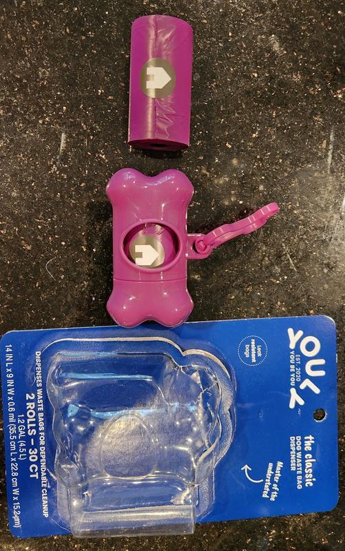 Opened product package, showing contents (2 bags and one dispenser)