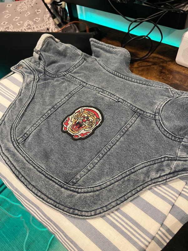 Me preparing to iron this patch on my cats jacket