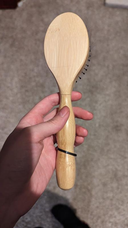 Forgot to take the black plastic ring off that attached the brush to the packaging.