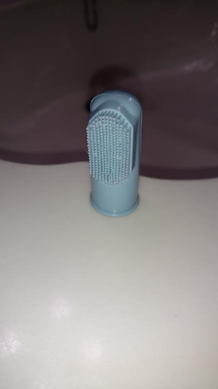 Finger tooth brush