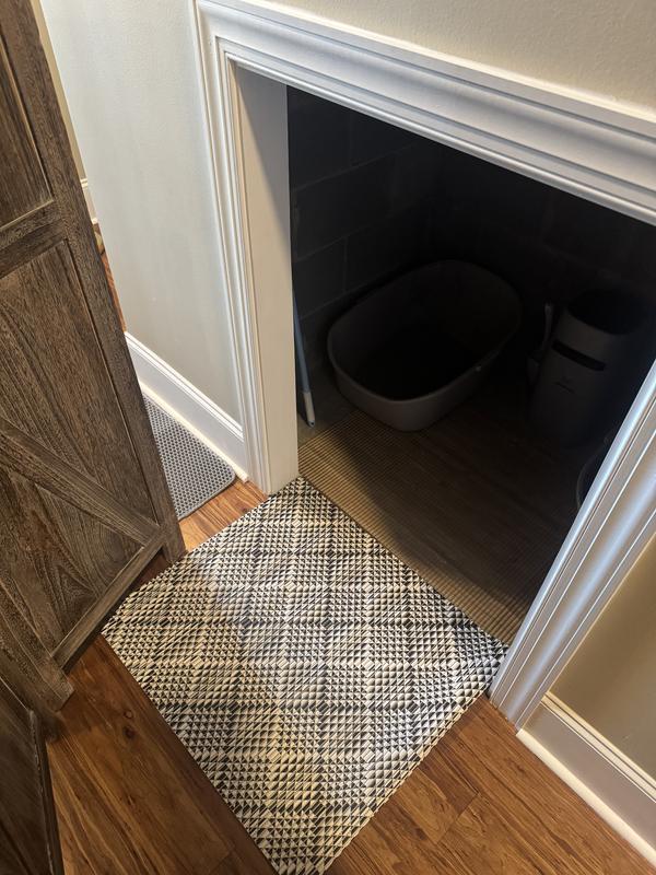 The mat is larger than shown in my image - I fold part of it under to make it fit this opening (which is approximately the size of a fireplace)