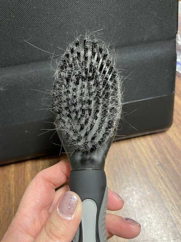 I tried to tilt it so you can see that after many brushes, it gets hardly any hair out. I have not cleaned out the bristles.