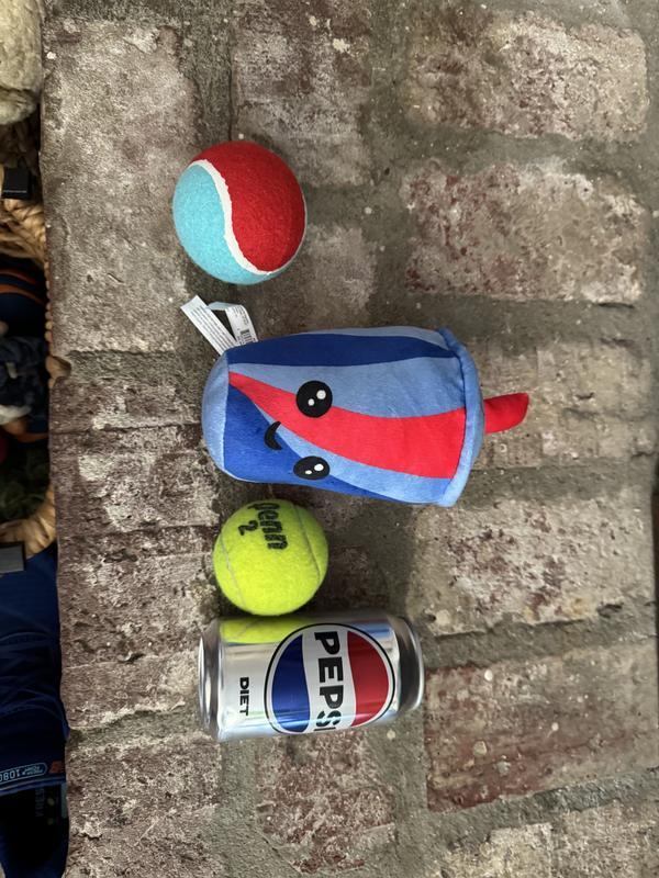 Ball on the right is a normal tennis ball. Definitely not a small toy!