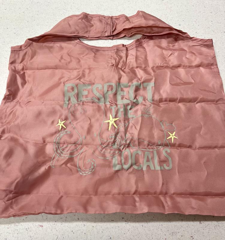 The saying “Respect the Locals” printed on it is adorable and perfect