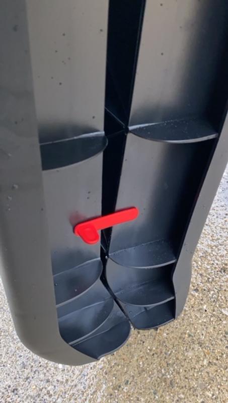 Red clamp locks the folded ramp in place.