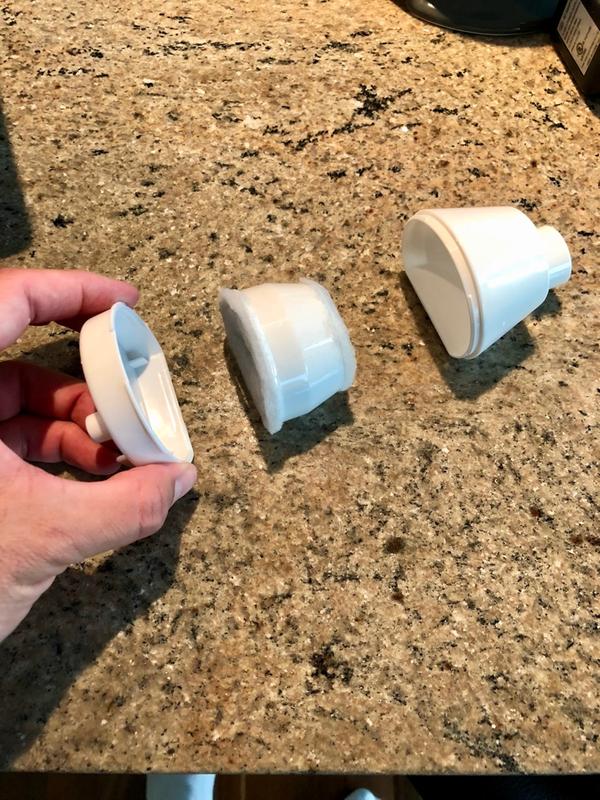 Carbon filtration unit. Use finger nails to help separate both pieces.